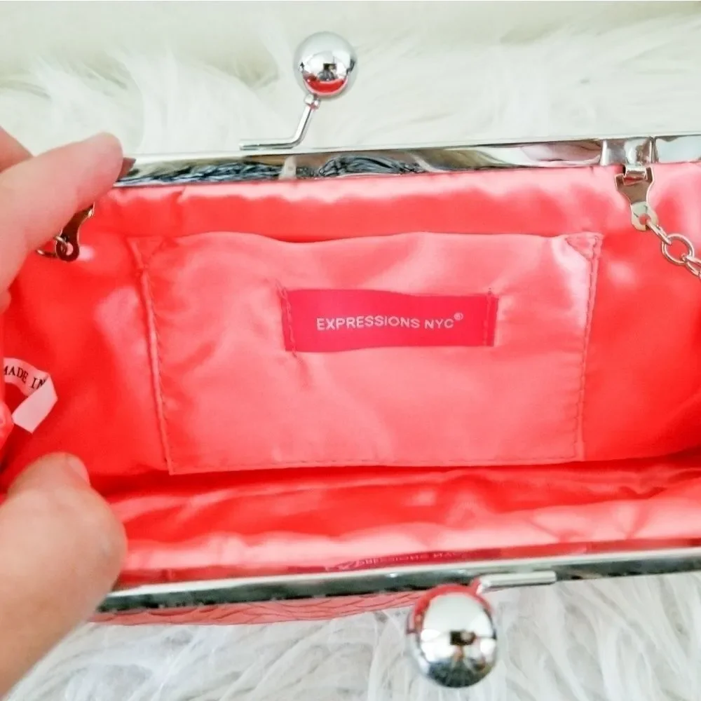 Expressions NYC clutch with metal shoulder bag